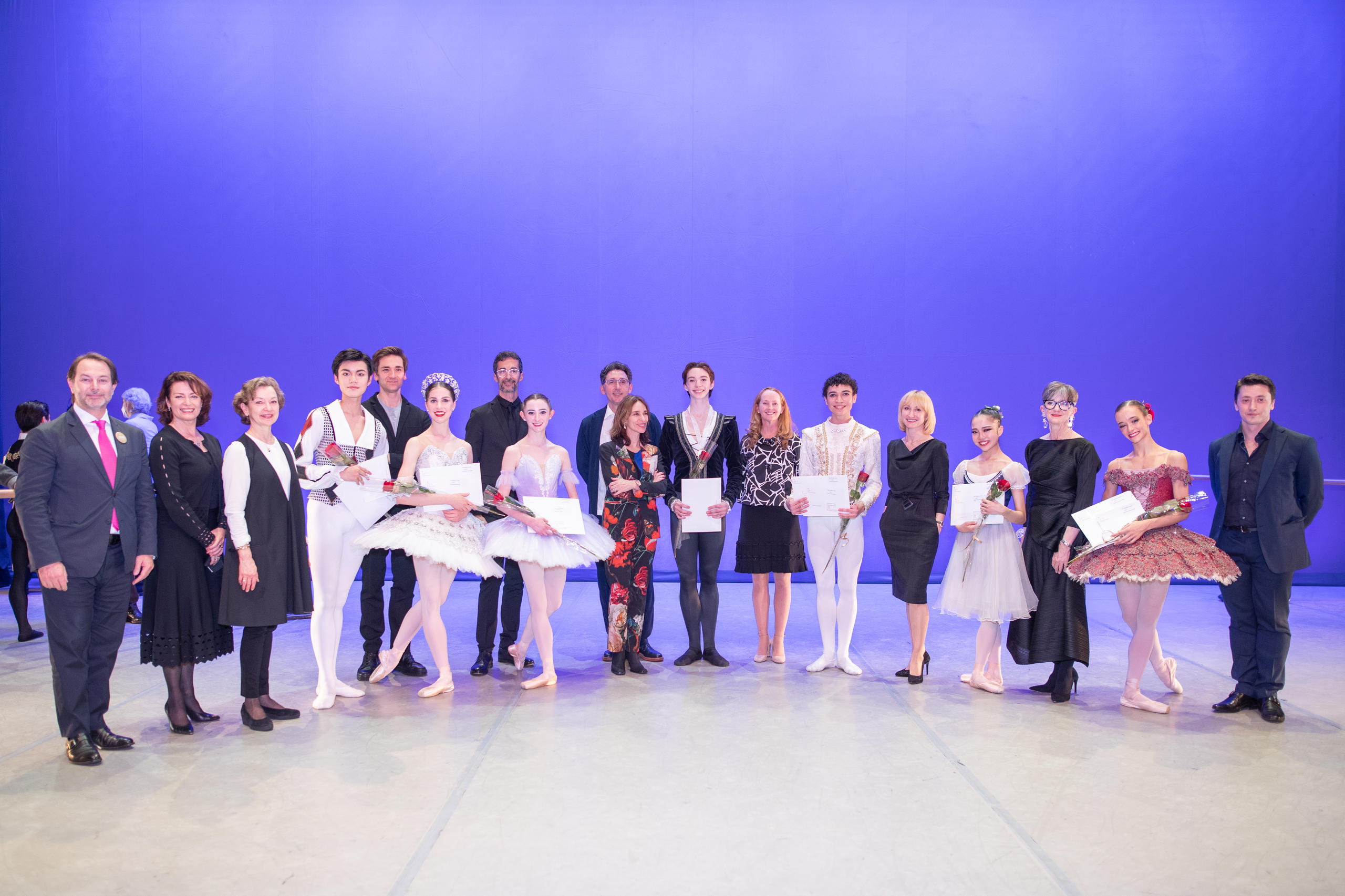 Winners and jury members of ballet competition posing for photographer