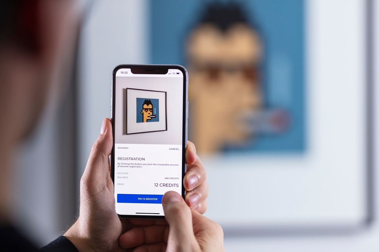 CryptoPunk digital image appears on a smartphone
