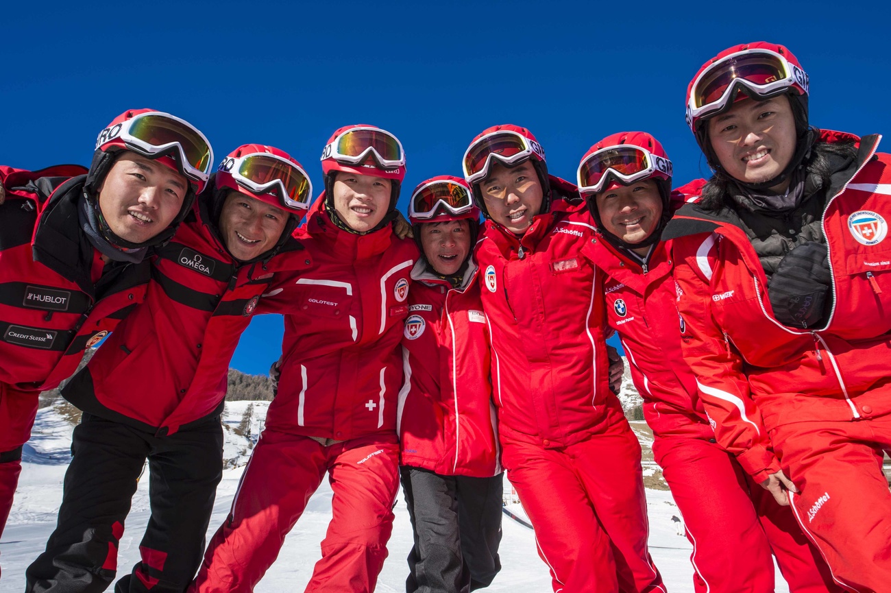 Chinesische Skilehrerinnen und Skilehrer