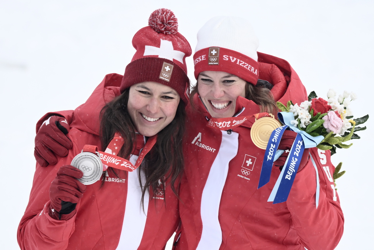 two happy successful swiss athletes