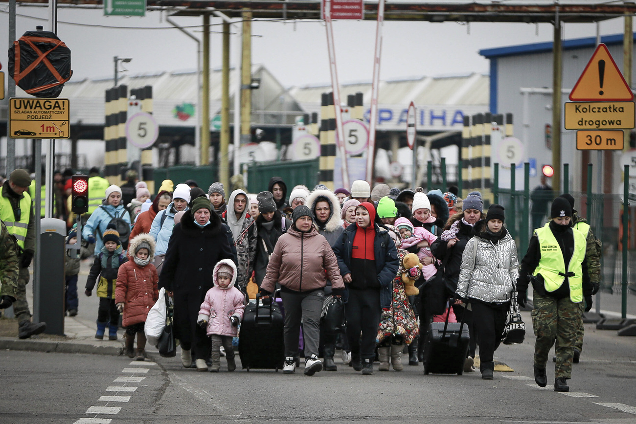 Rifugiati ucraini al confine con la Polonia.