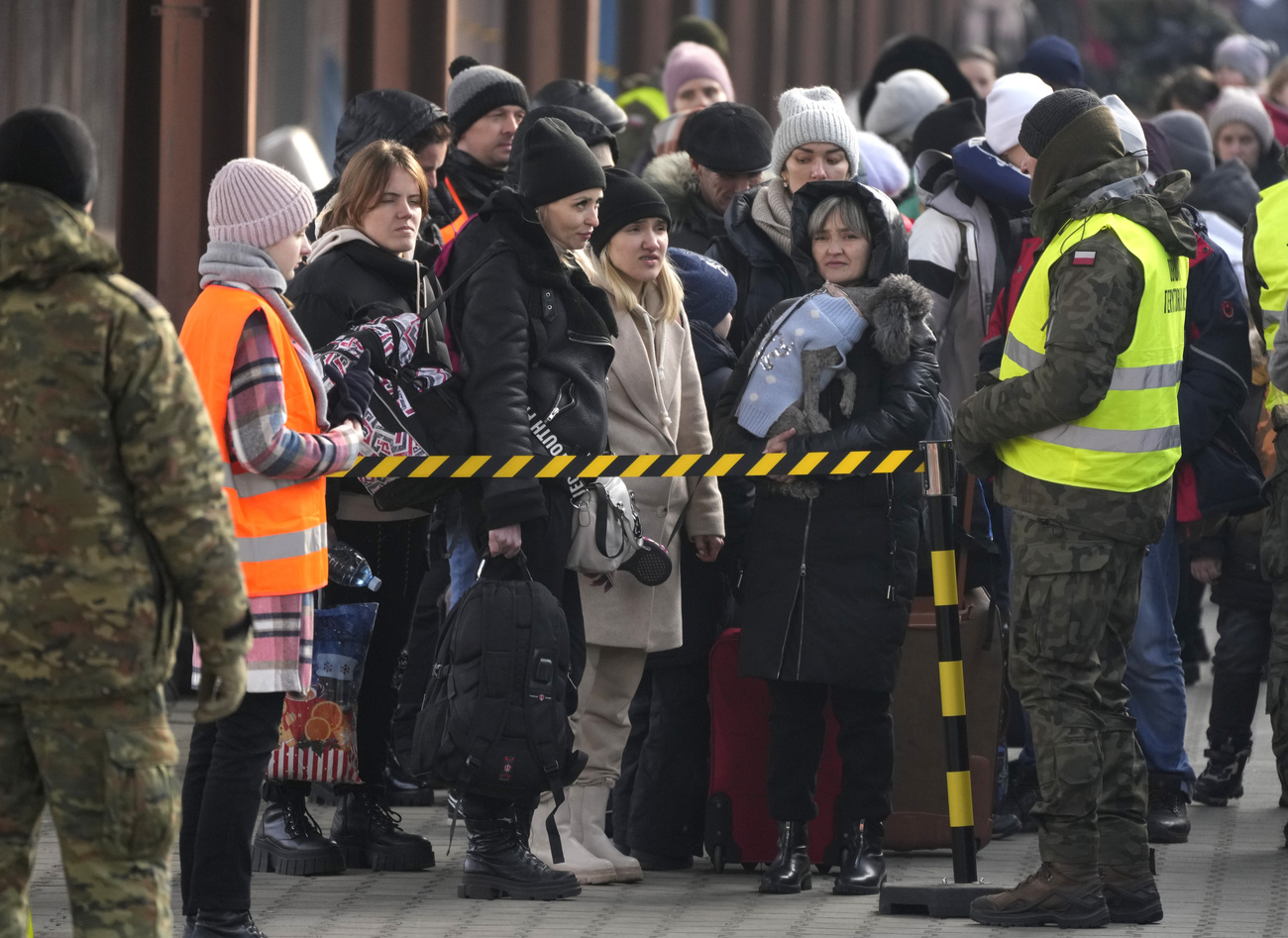 people queuing in cold