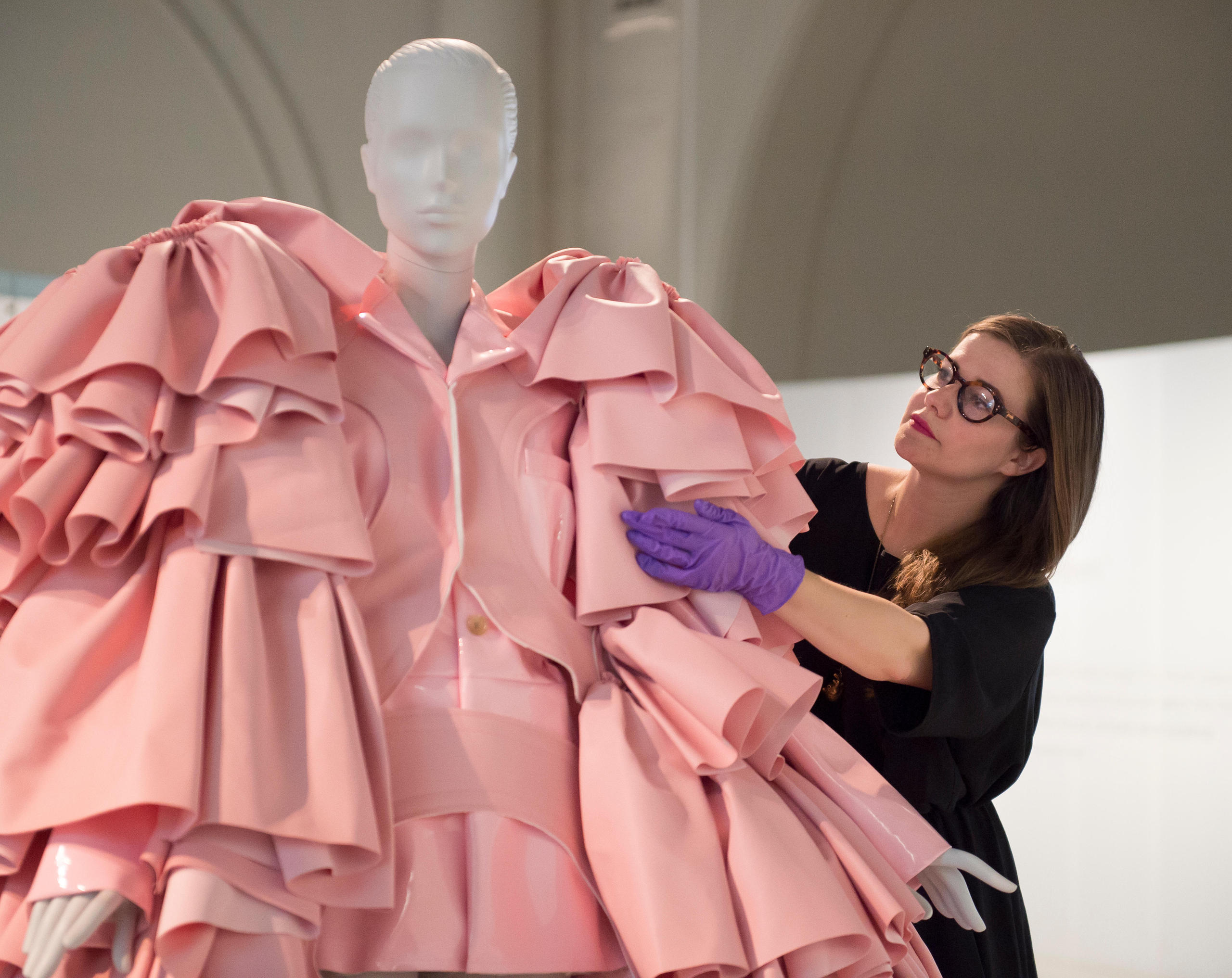 Cristobal Balenciaga fashion. A pink robe dressed on a mannequin.