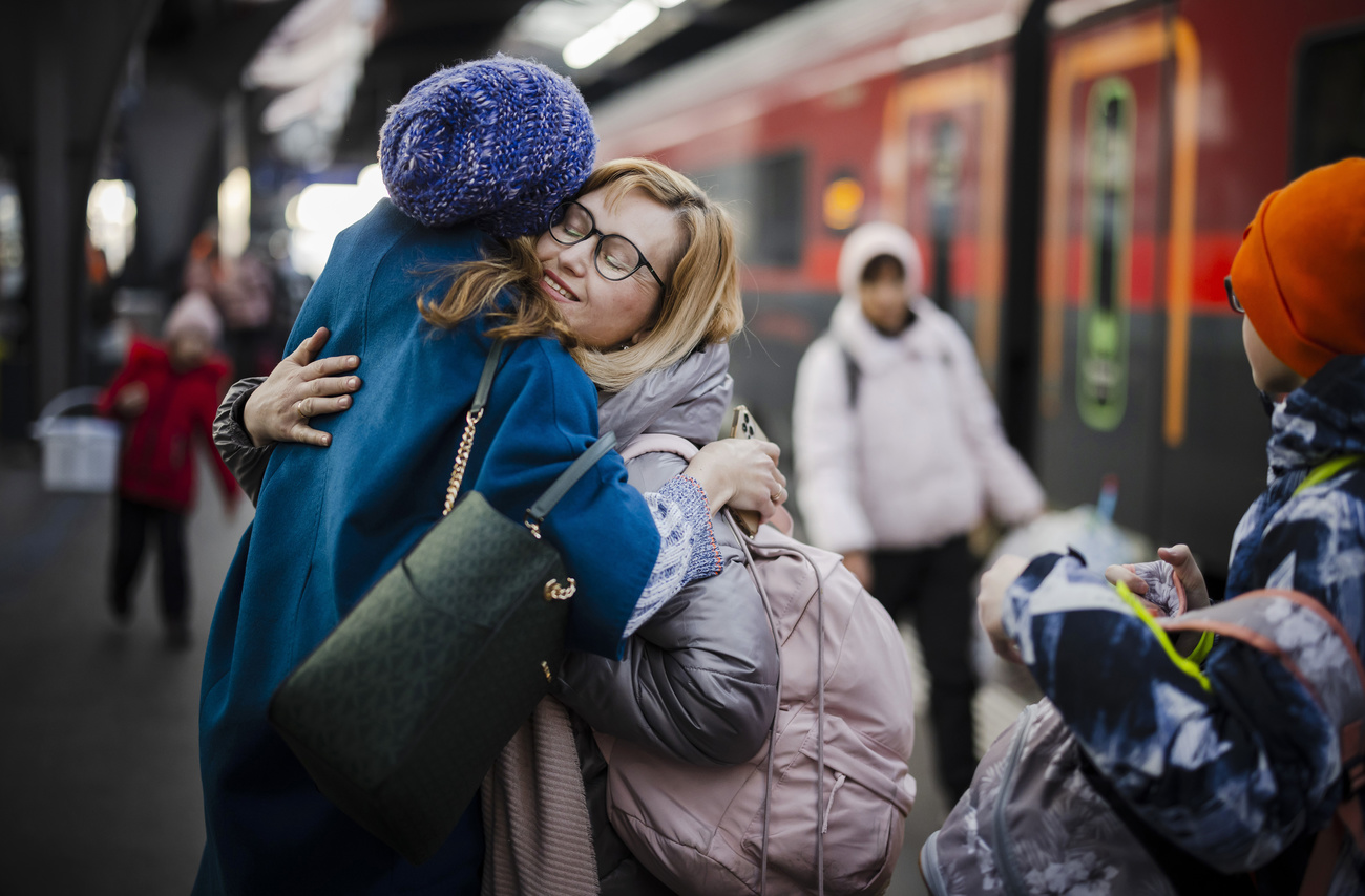 A woman from Ukraine reacts after being greeted at Zurich s central station on March 9, 2022.