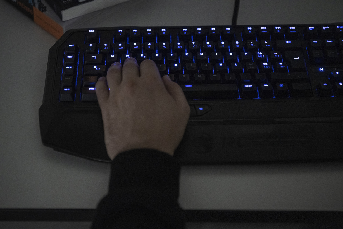 hand on computer keyboard