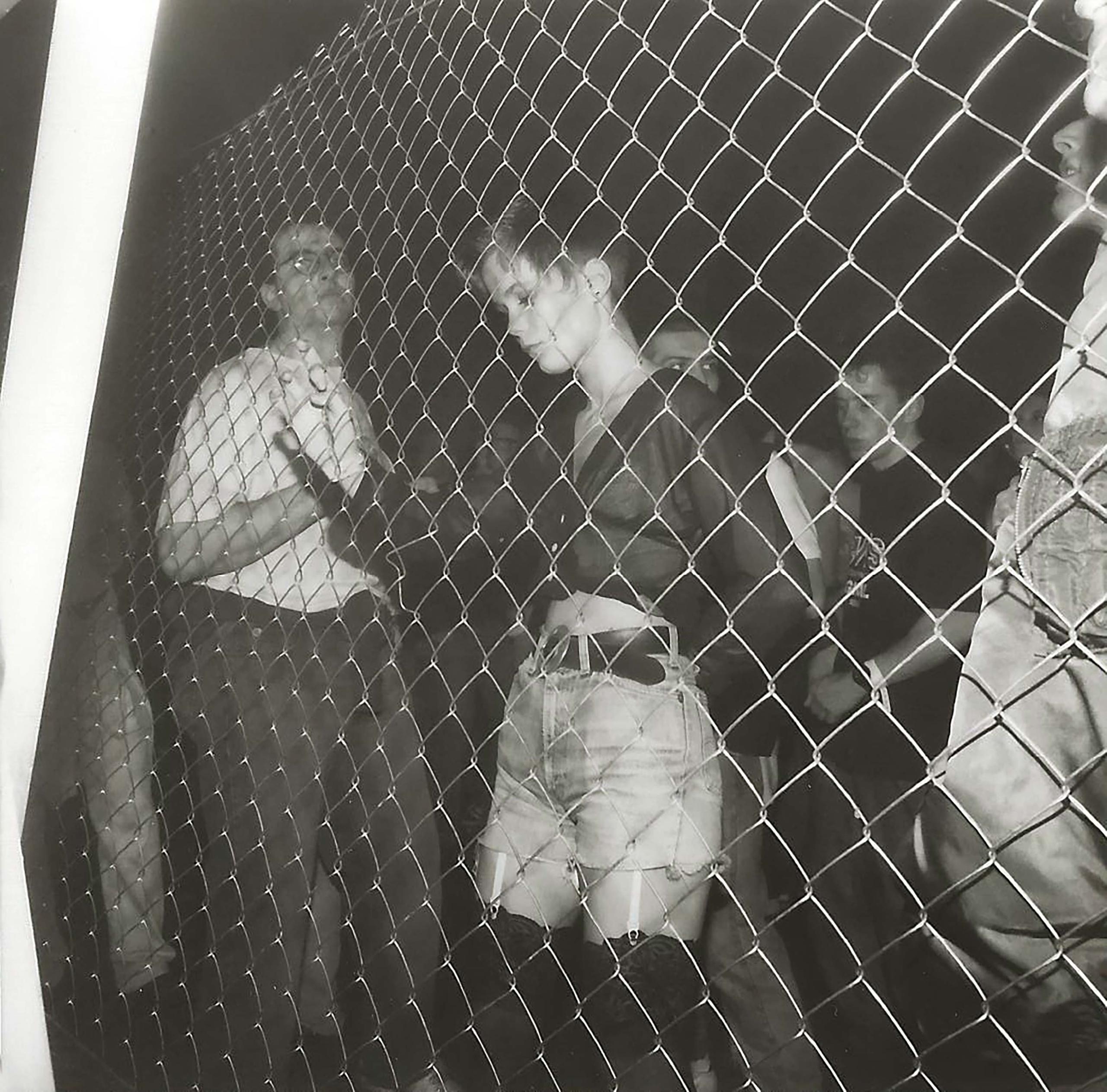 woman in front of fence