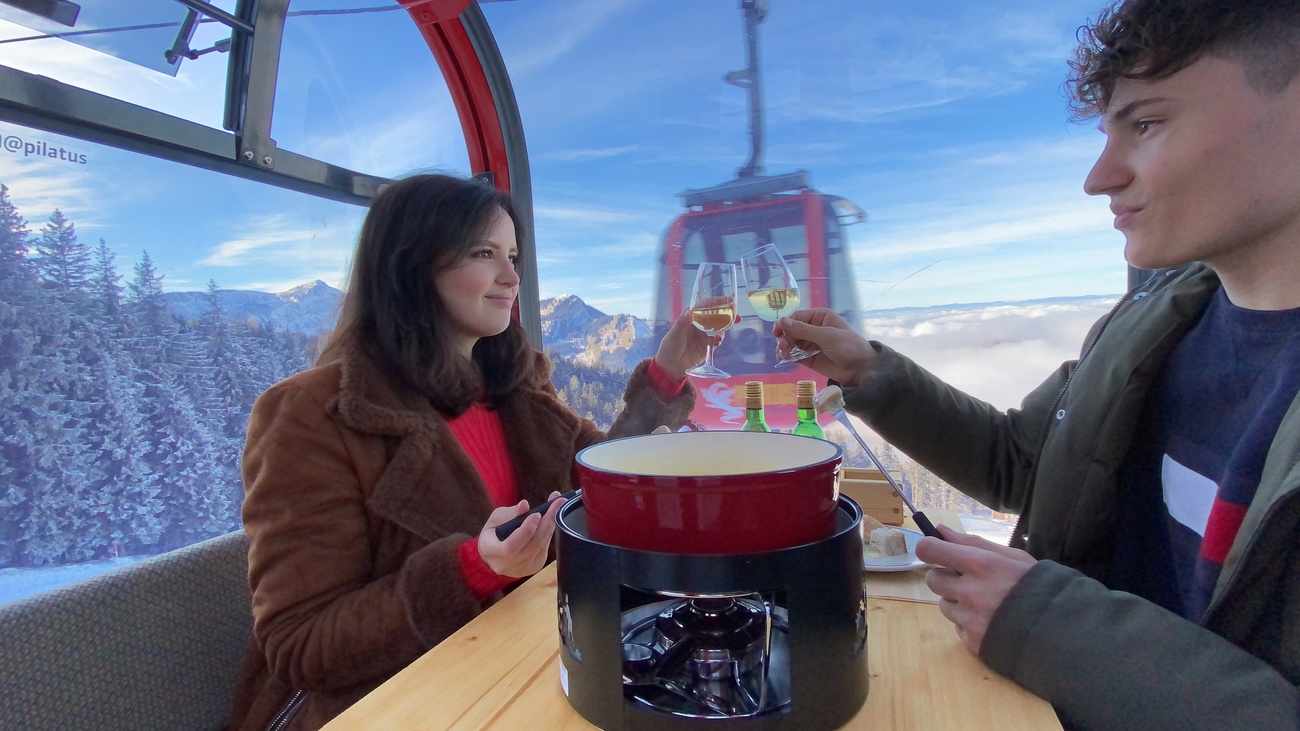 Fondue in a ski gondola in Switzerland.