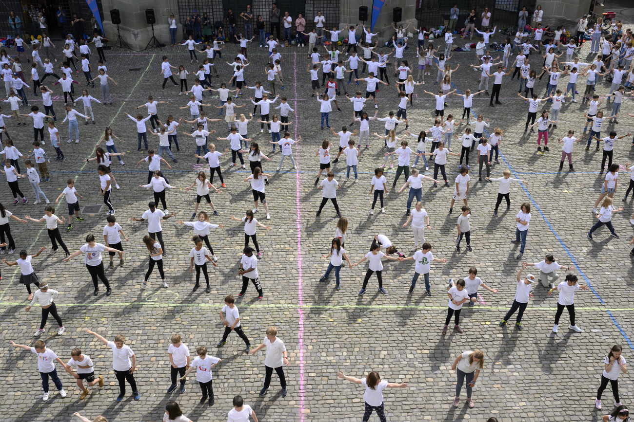 Children dancing in street.