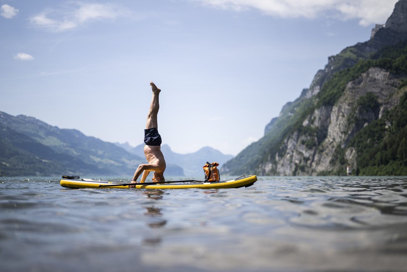 Man on paddle board in Switzerland.