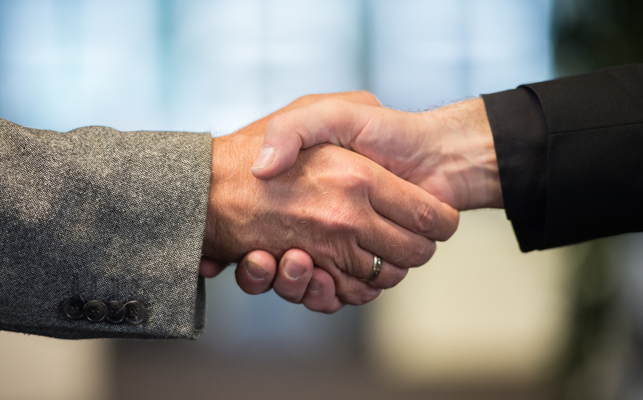 Two people shaking hands