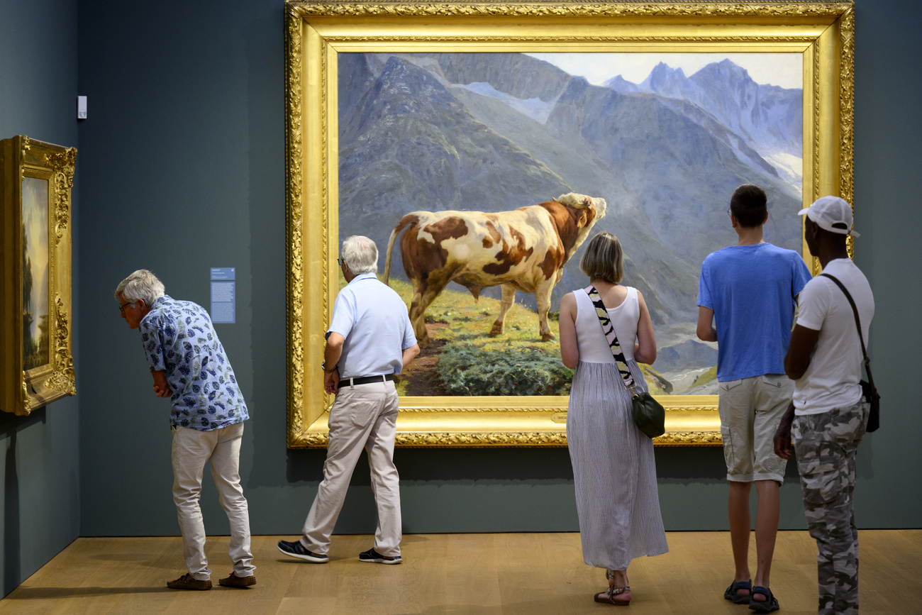 people looking at art