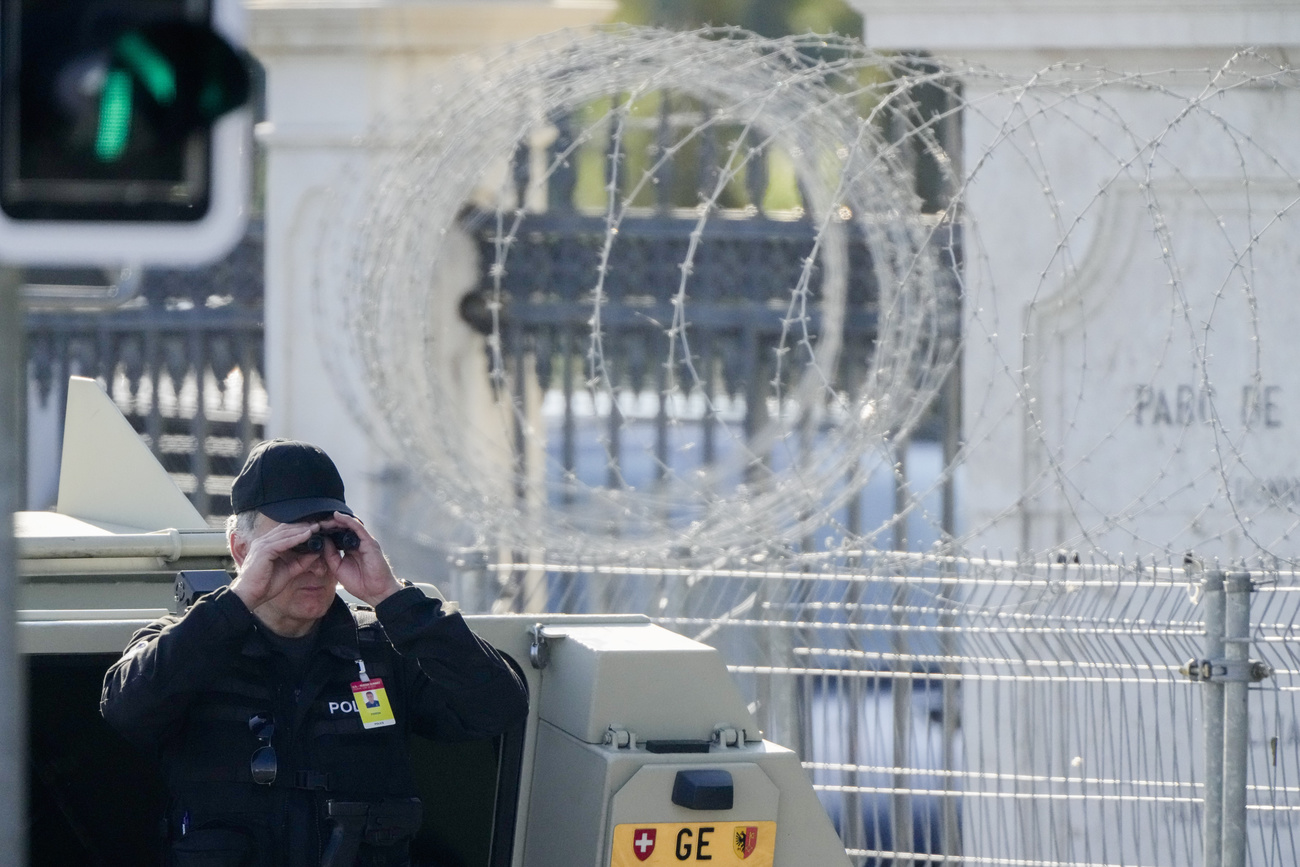 Policeman looks through binoculars