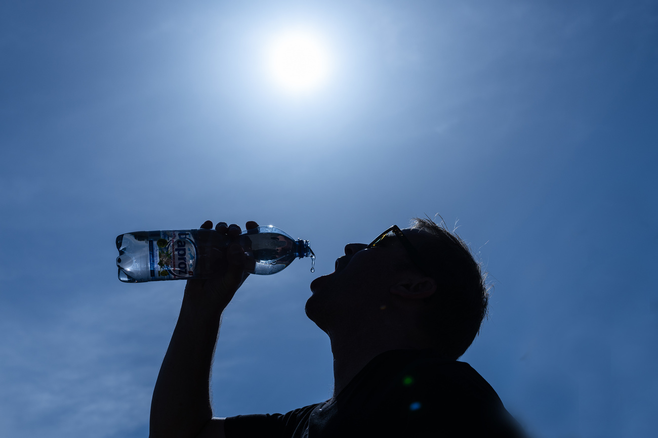 Man drinking water from bottle.