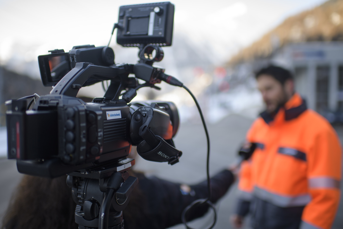 Journalist interviewing man