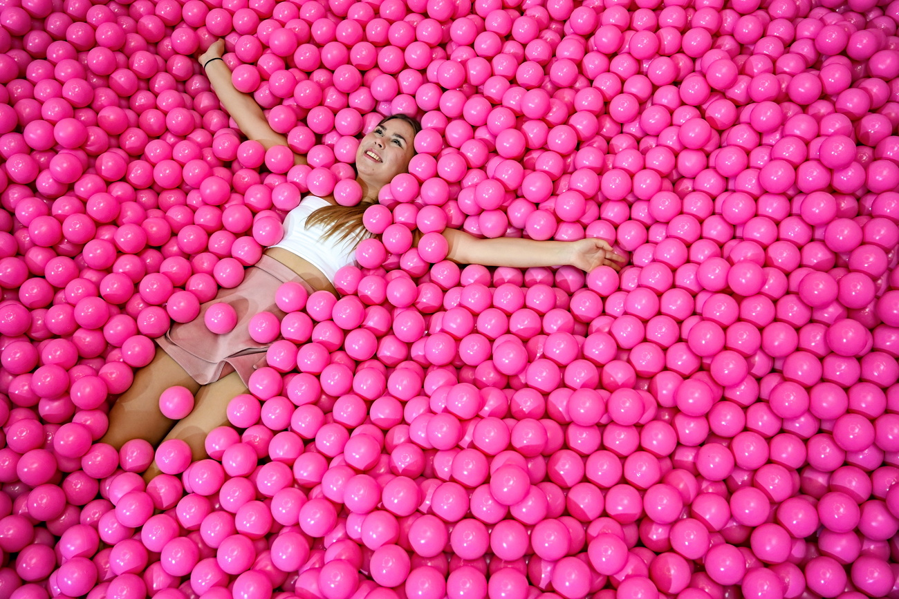 Girl surrounded by balls