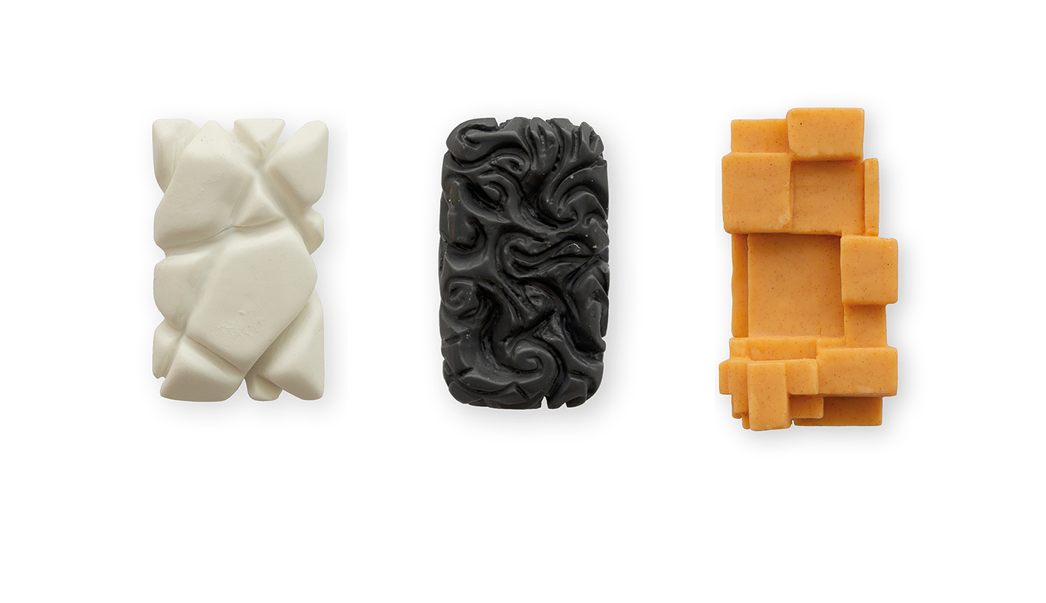 Three carved tablets of soap.