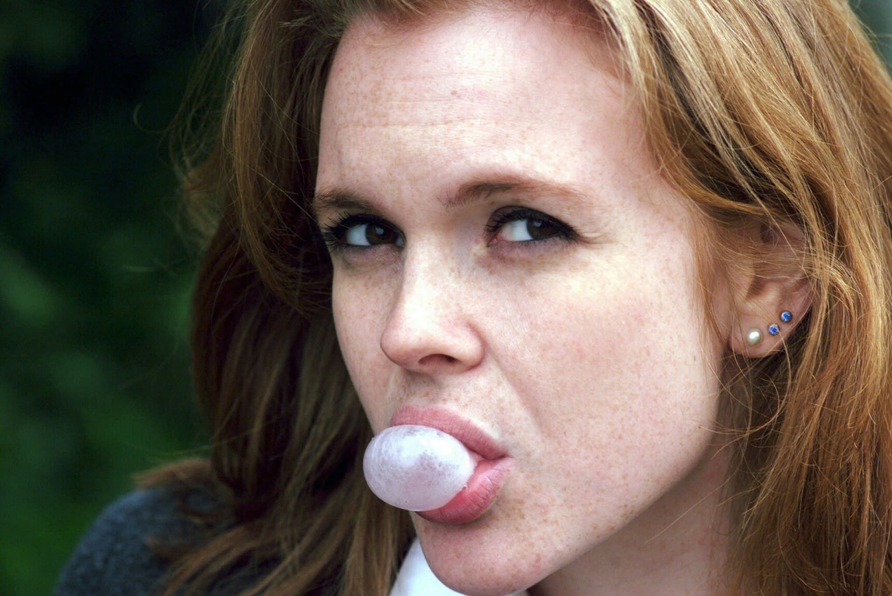 woman blowing chewing gum bubble