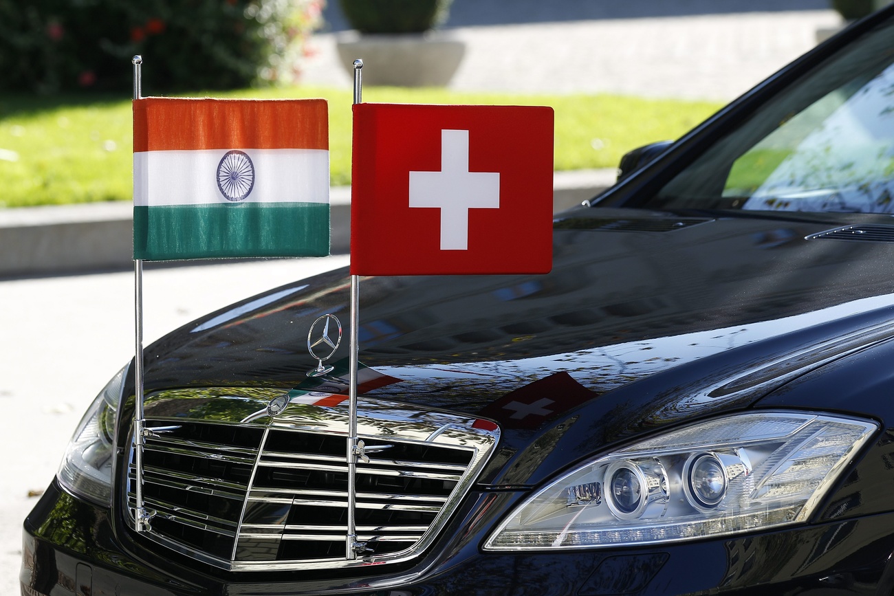 Indian and Swiss flags on limousine