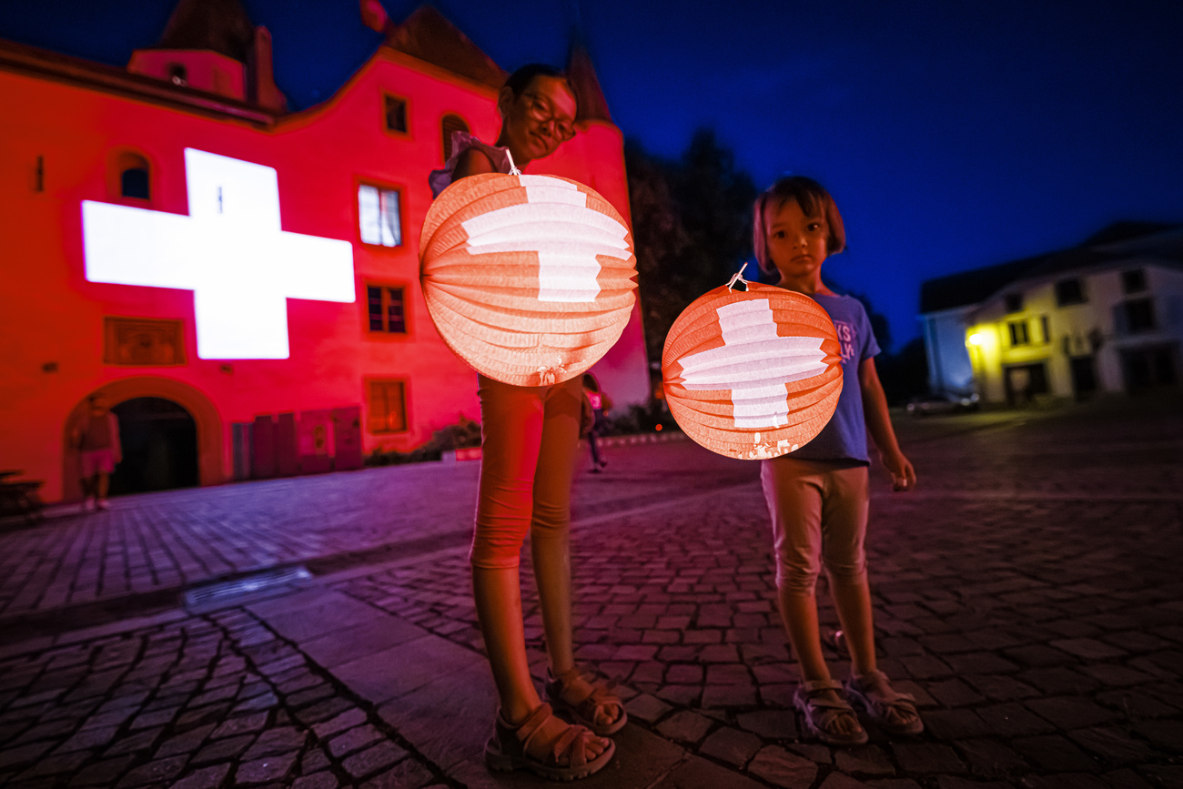 Girls with Swiss flag lanterns
