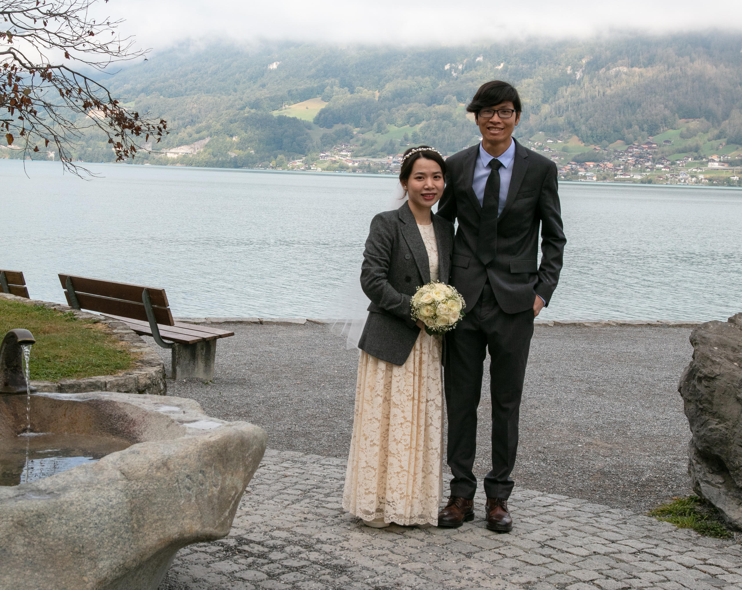 Bride and groom posing for a commemorative photograph.