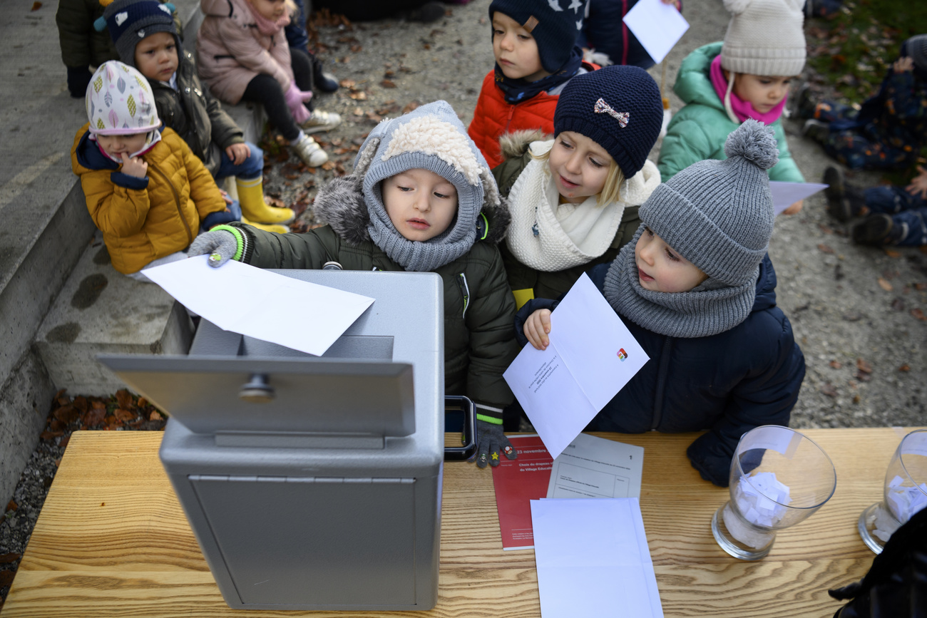 Children with ballot papers and and a ballot box