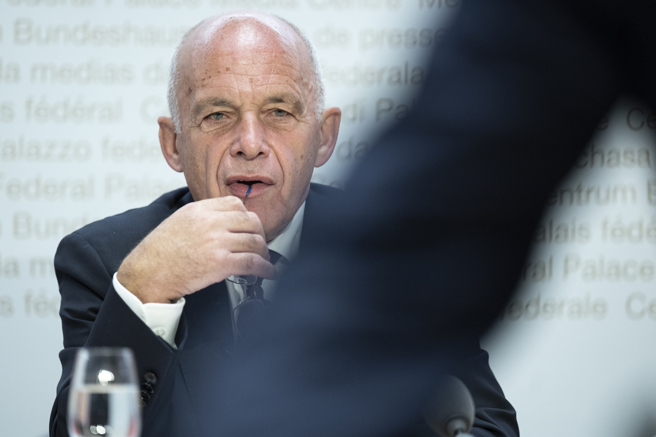 Finance Minister Maurer chewing