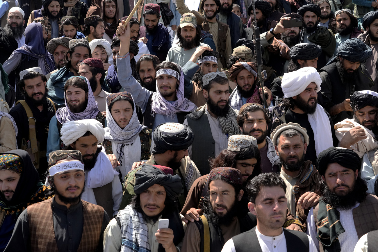 A crowd of people celebrates in Kabul