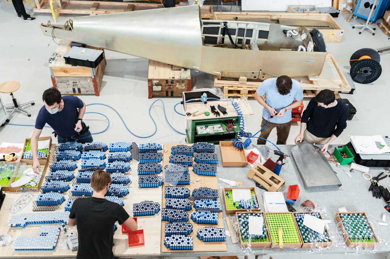 Students working on a plane.