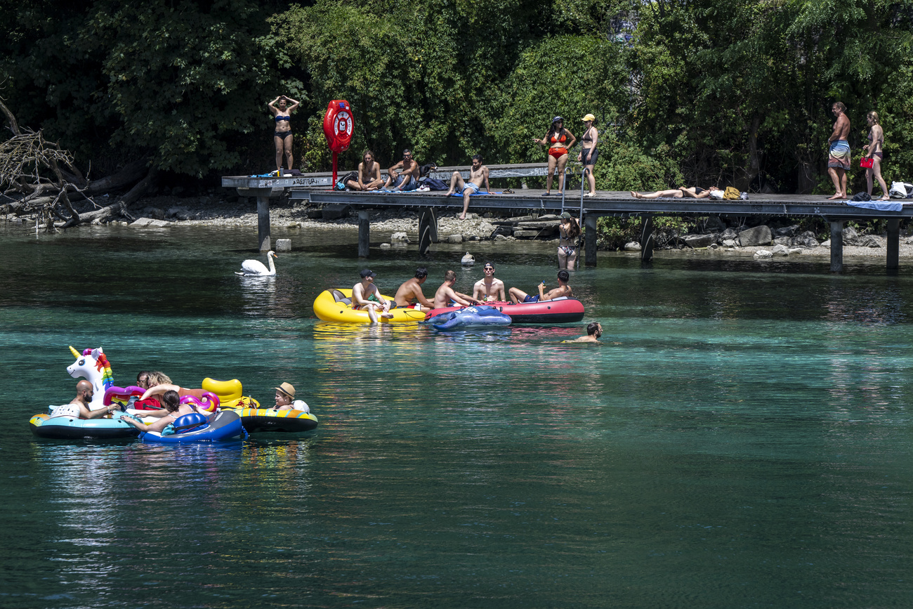 People swimming in river Rhône in Geneva.