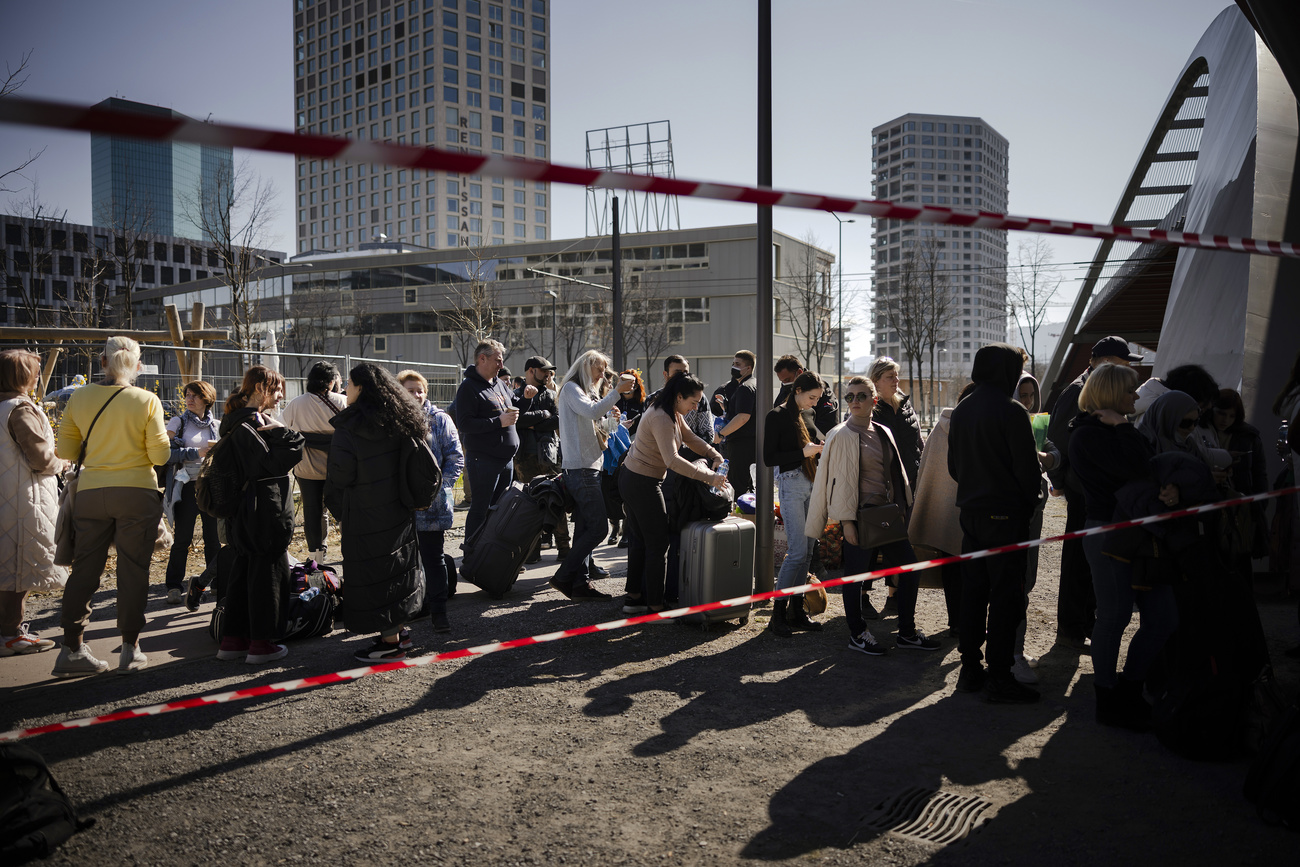 Ukrainian refugees queueing in Zurich