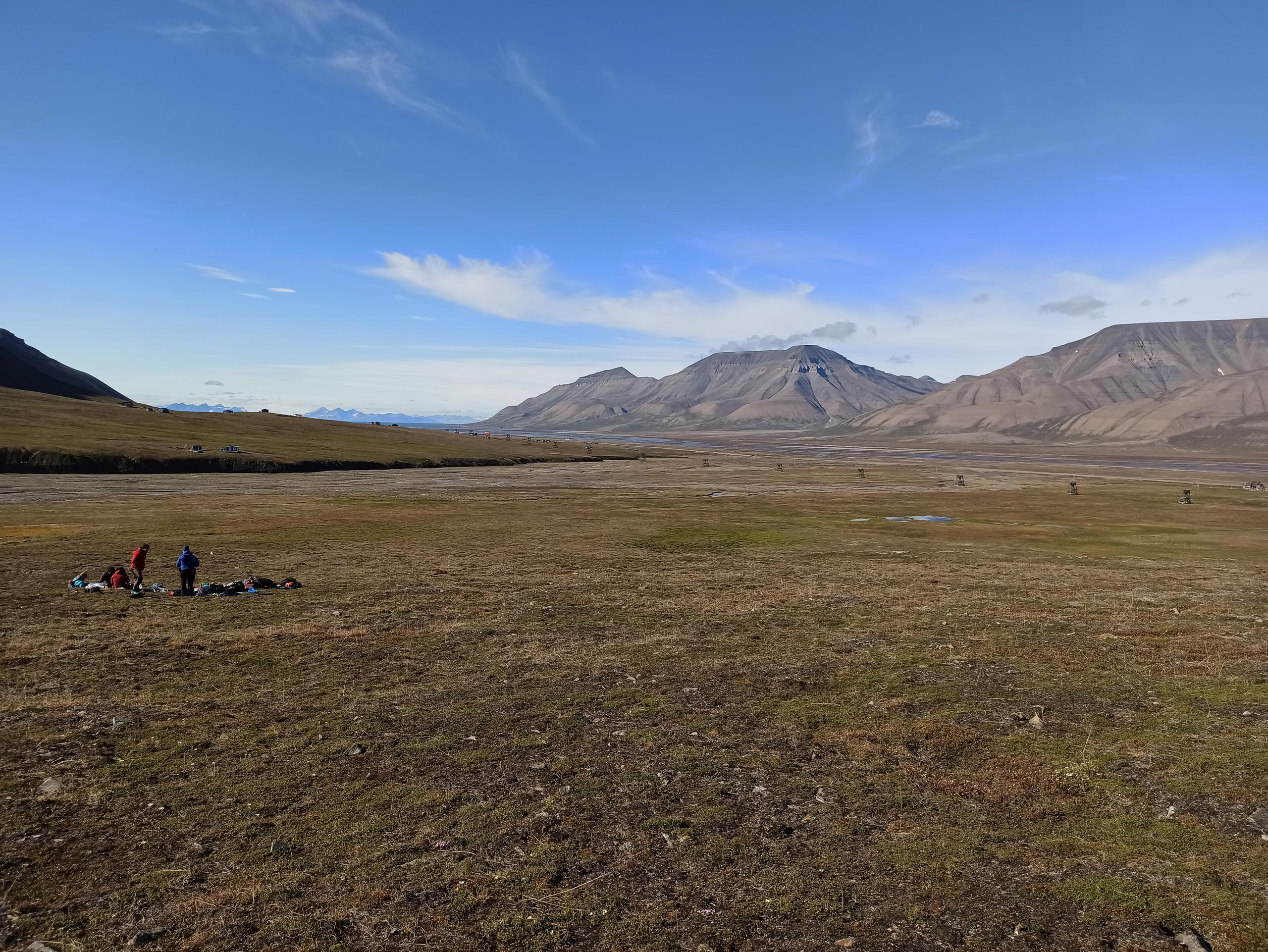 Tundra scene with several people