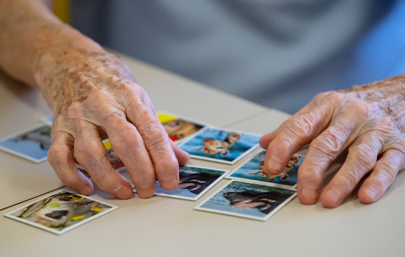 Old person s hands with memory game.