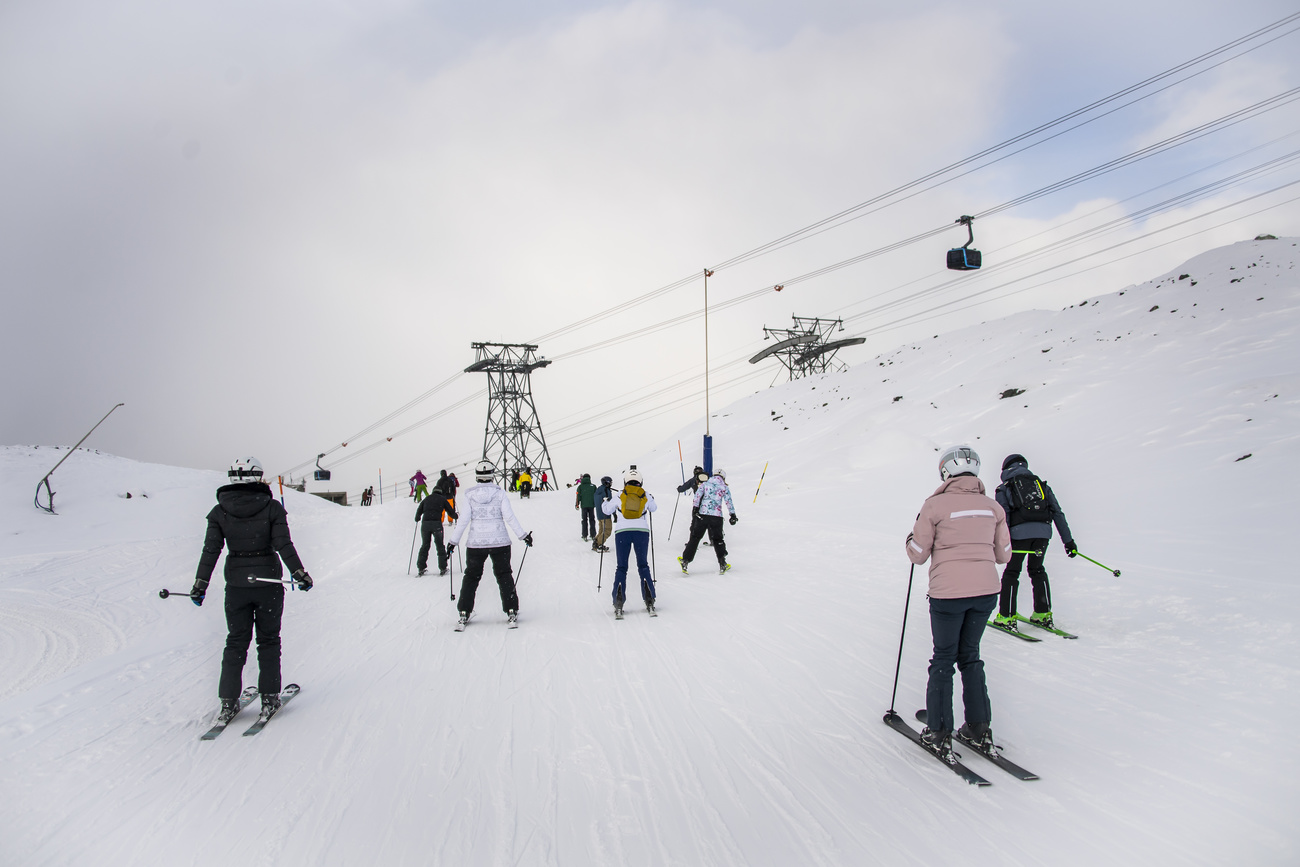 Skiers near a ski lift in Zermatt