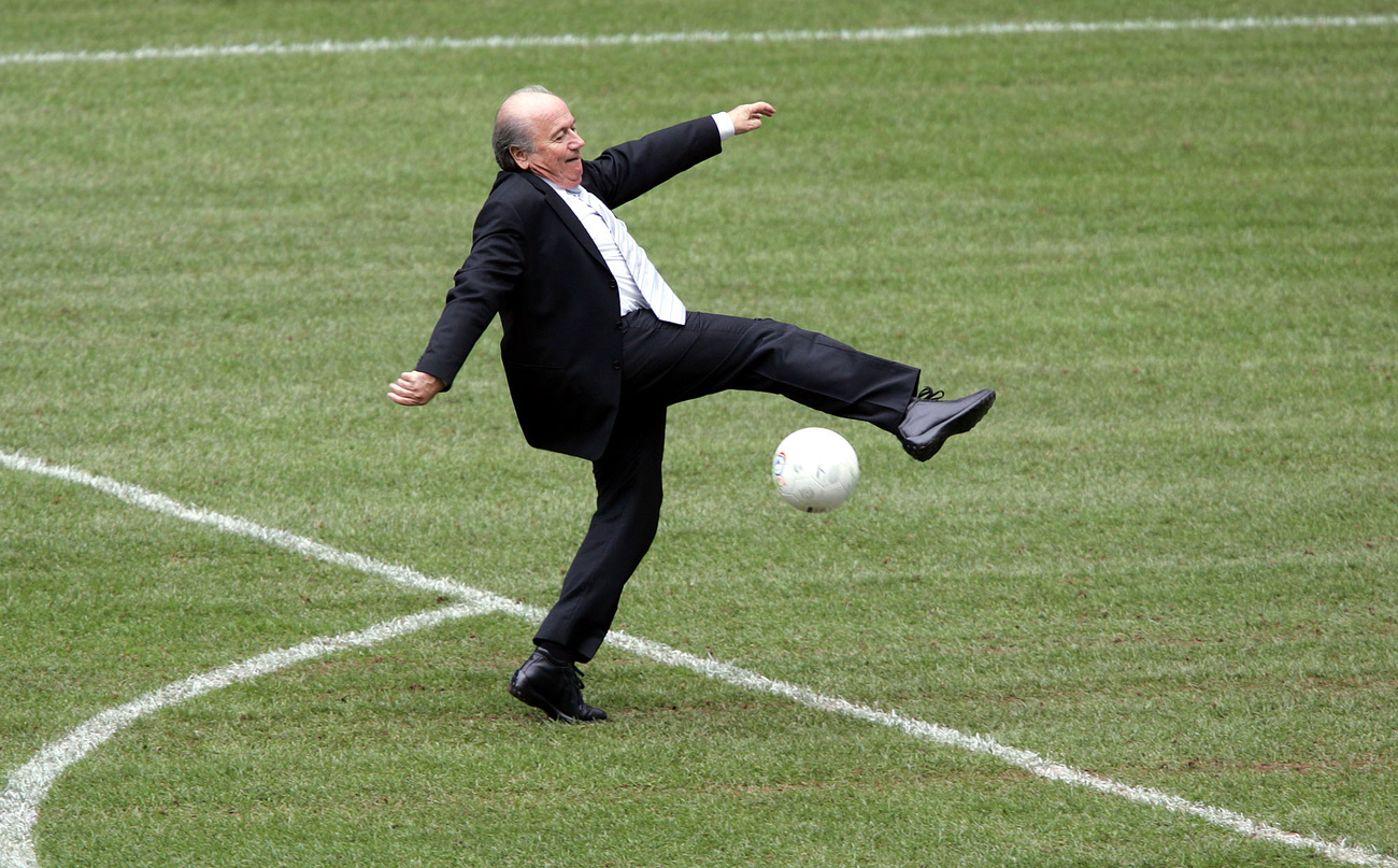 Man kicking a football