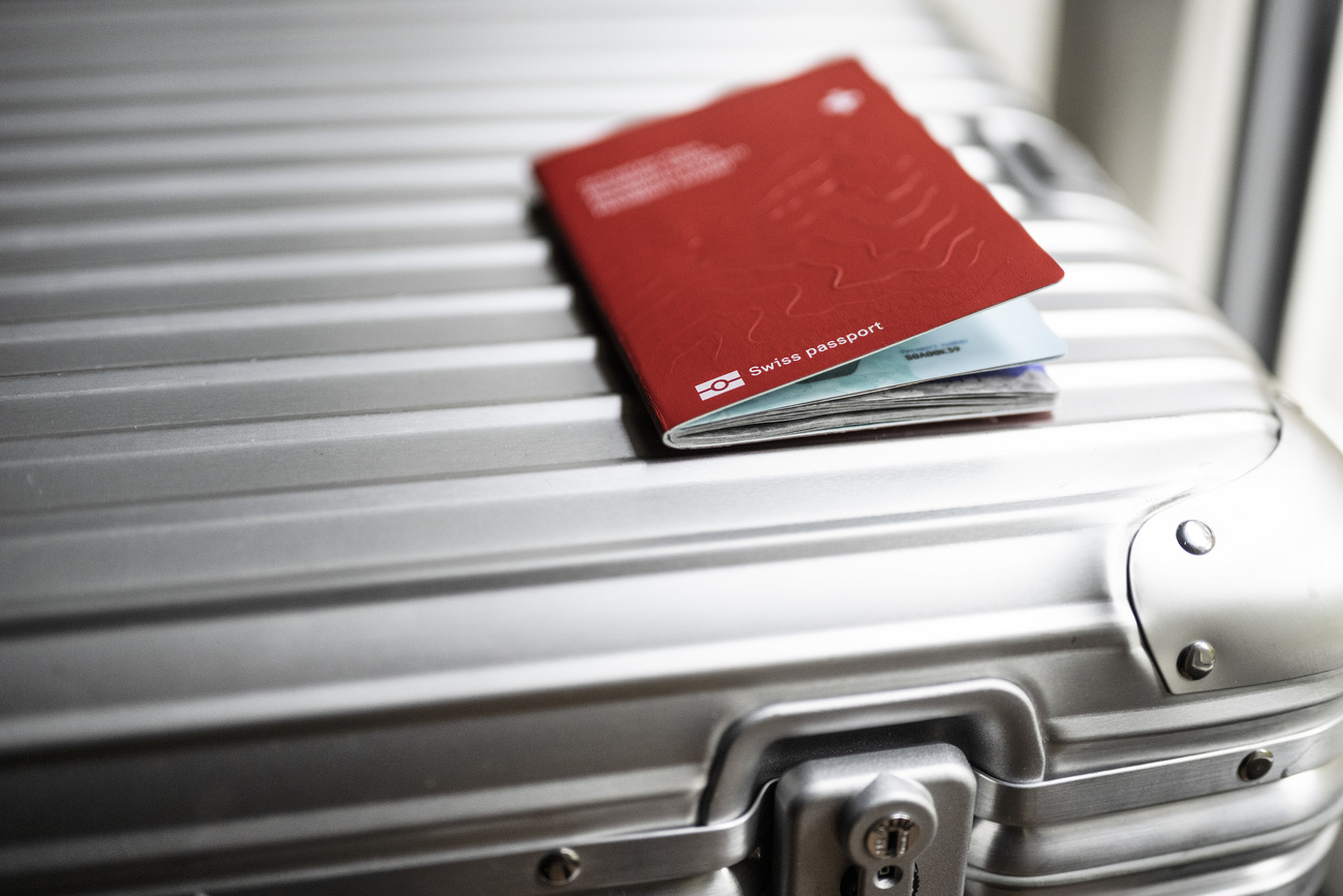 Swiss passport on a suitcase