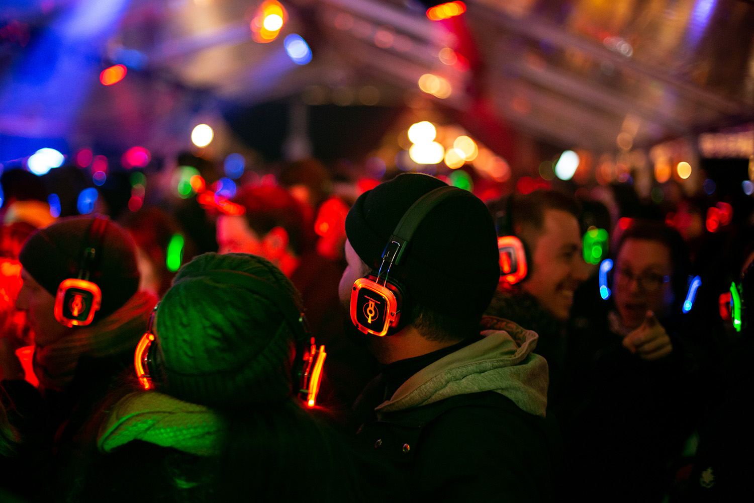People wearing glowing earphones for a Silent disco
