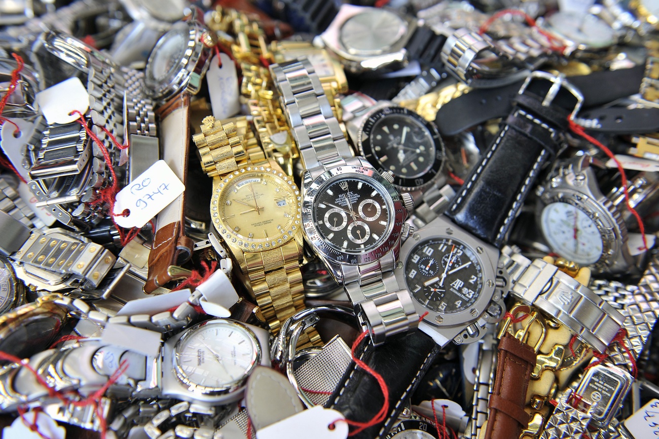 pile of counterfeit watches