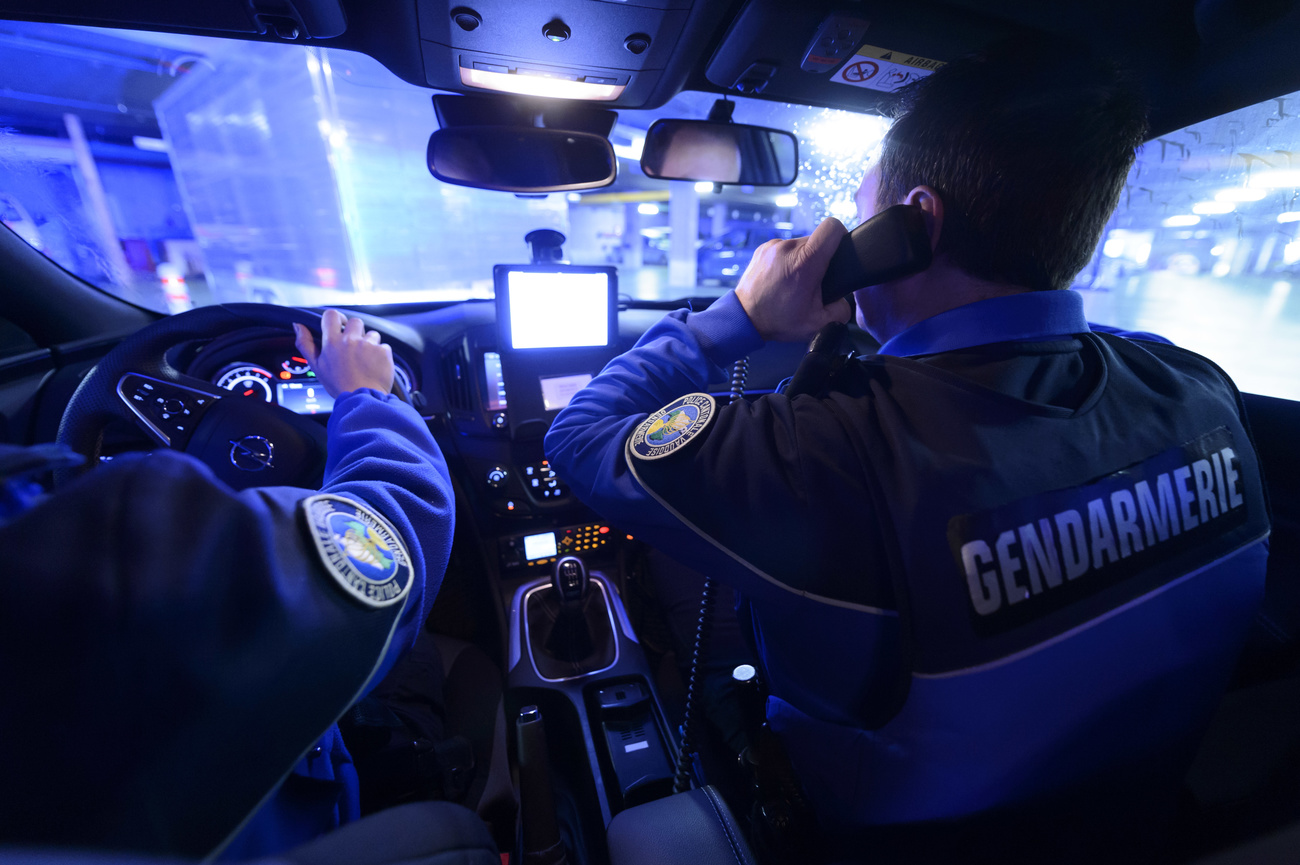 Policeman on phone in car