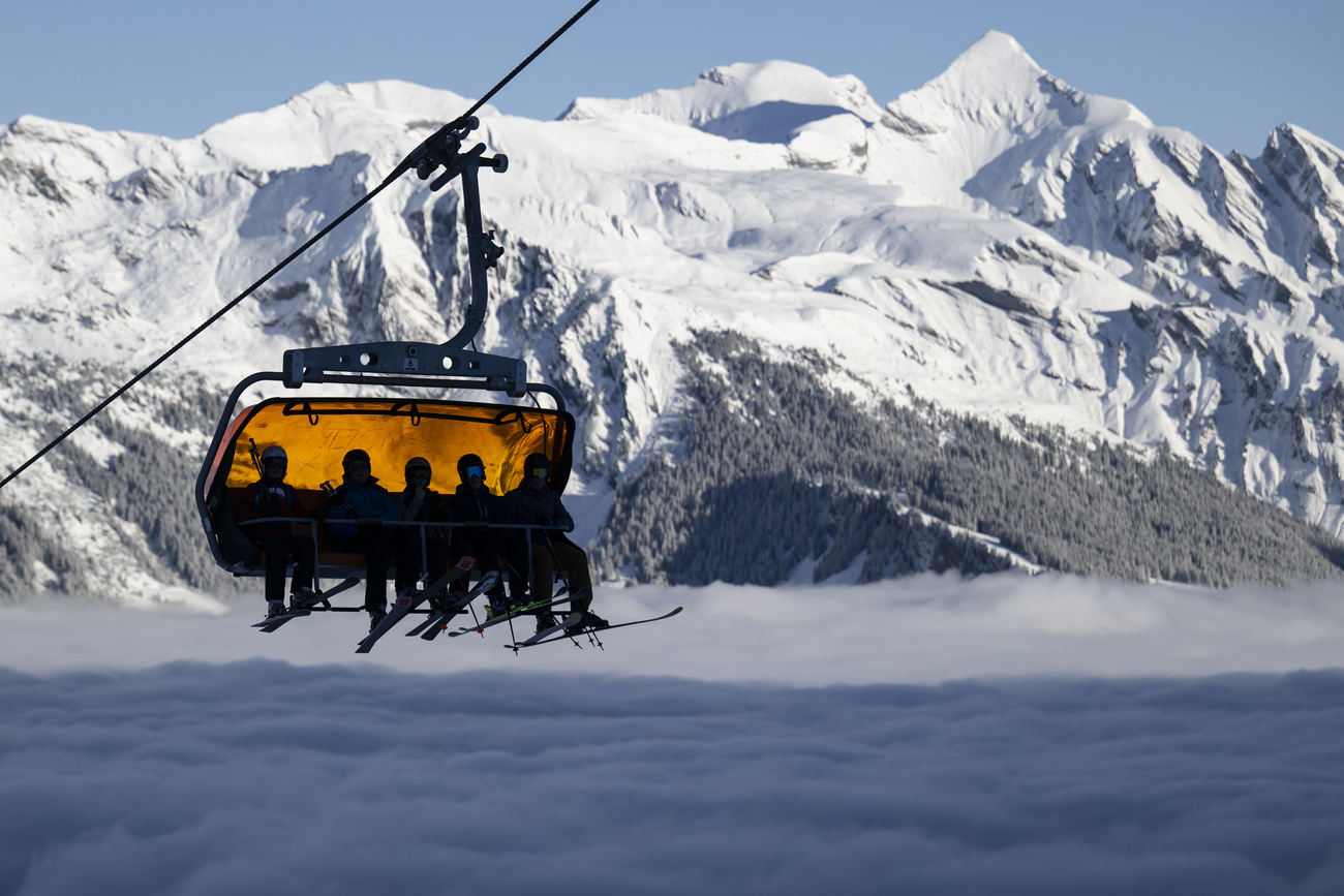 Skiers in a Swiss gondola