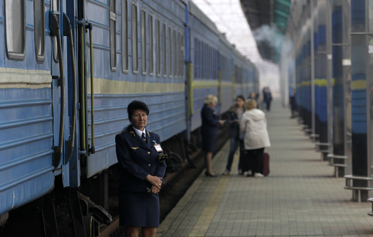 People boarding a train in Russian occupied Donetsk, Ukraine.
