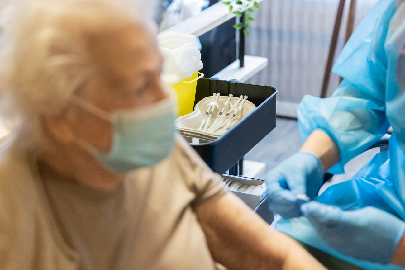 elderly person being vaccinated