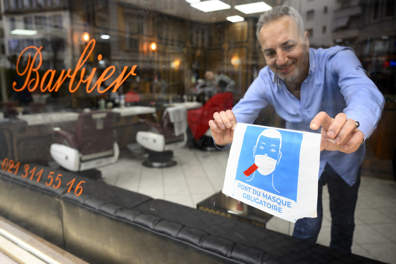Swiss barber with mask sign