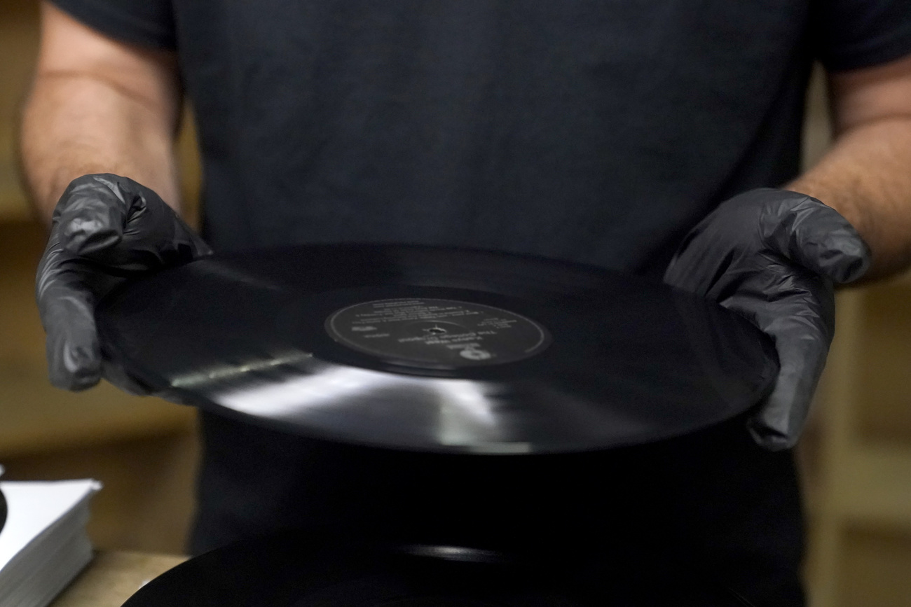 man holding vinyl record