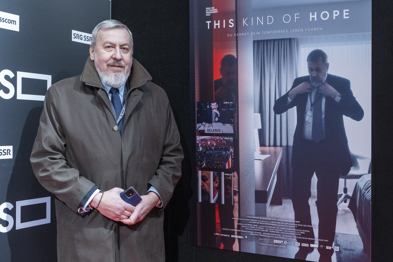 Andrei Sannikov in front of a poster of the film, in Solothurn