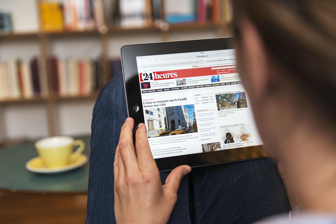 Woman reading online newspaper on mobile device