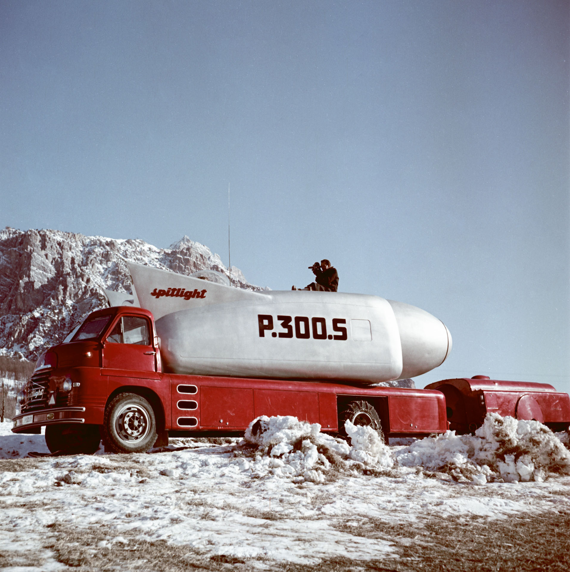 A truck in the snow carrying the Spitlight at Cortina d Ampezzo, January-February 1956