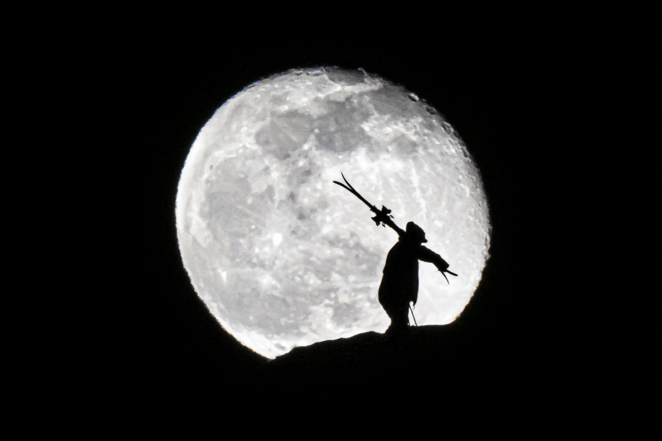 full moon and silhouette of person