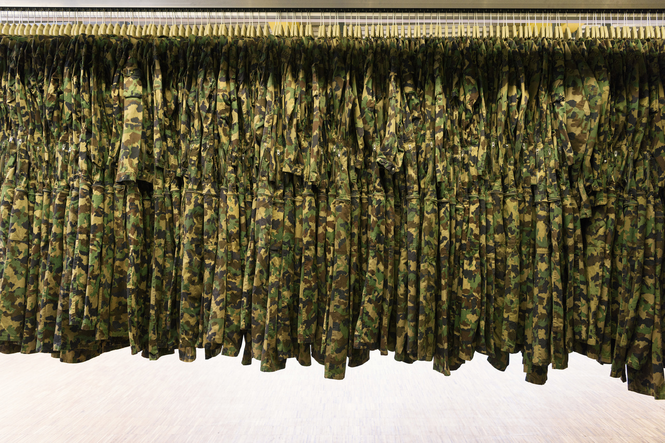 Army uniforms on coat hangers