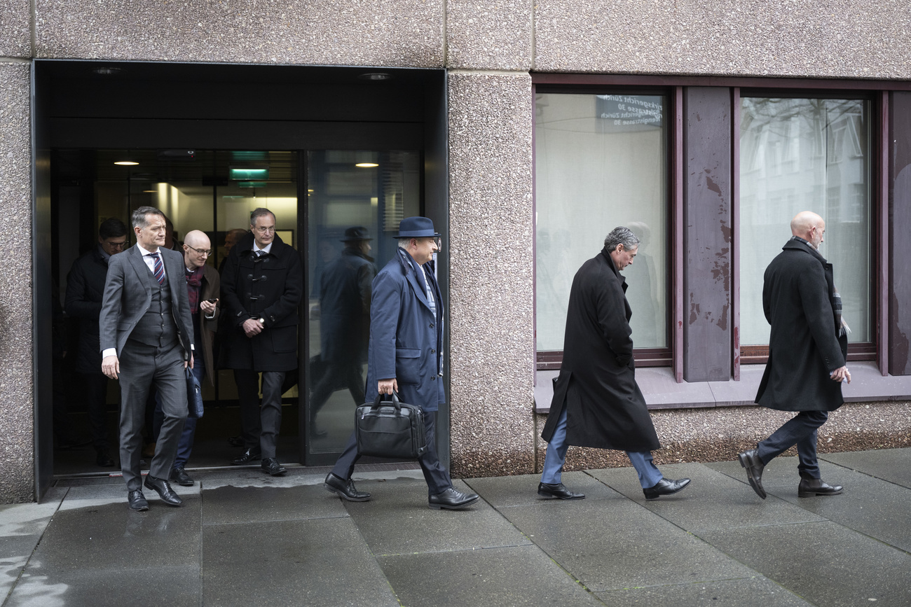 People leaving a district court building in Zurich