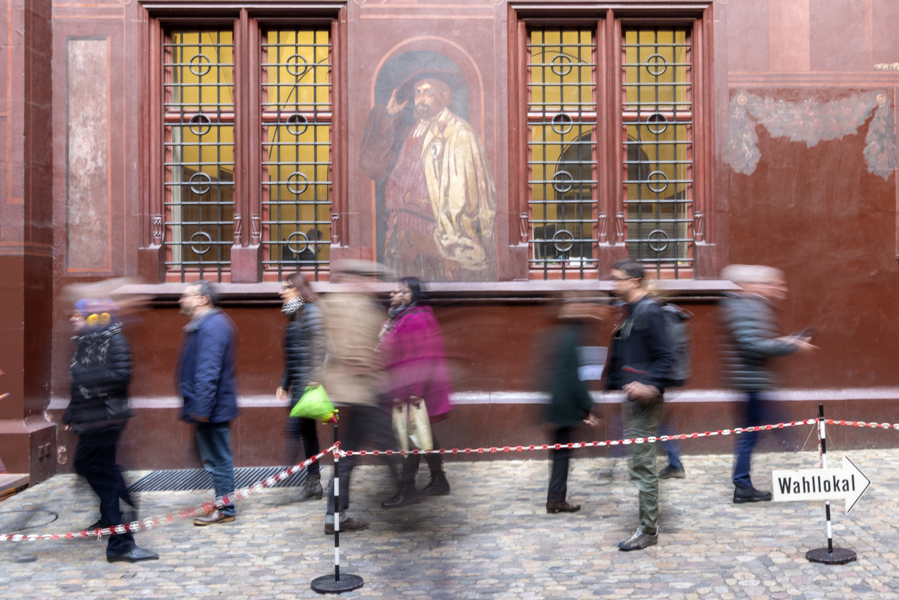 people outside a polling station in Basel